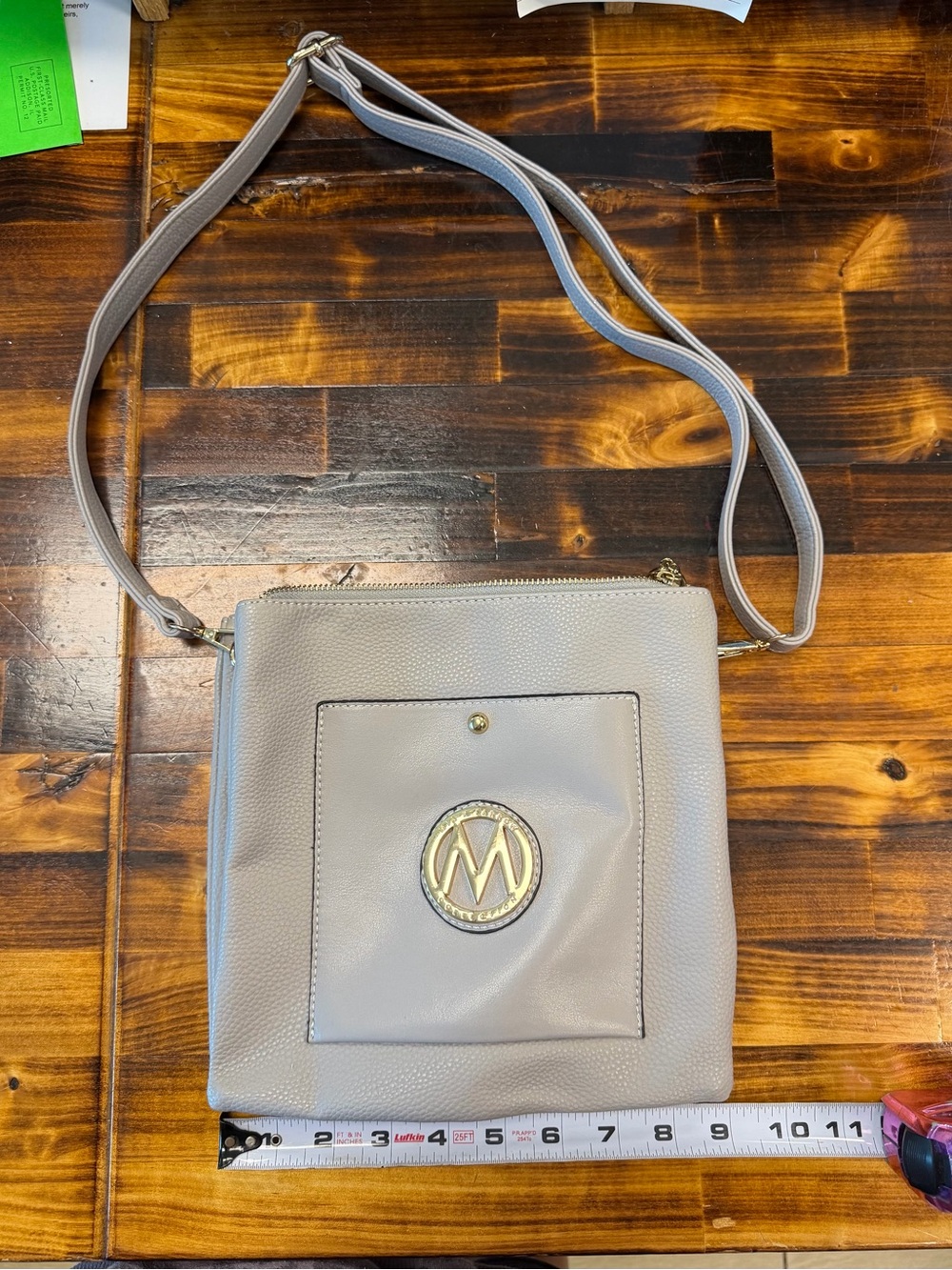 Gray Crossbody Bag with Gold Emblem Accent